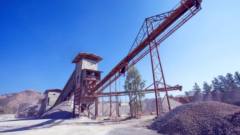 Stone crushing plant conveyor feeding an aggregate stockpile