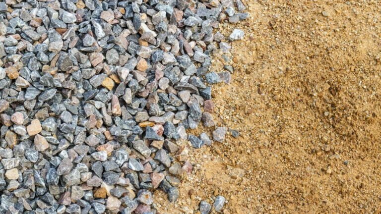 Crushed stone aggregate beside crushed sand